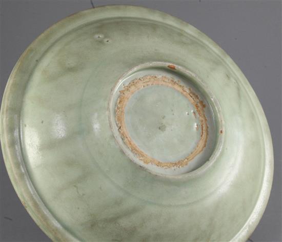 A Chinese Longquan celadon dish, 15th / 16th century, diameter 27cm, crack to rim, wear to glaze